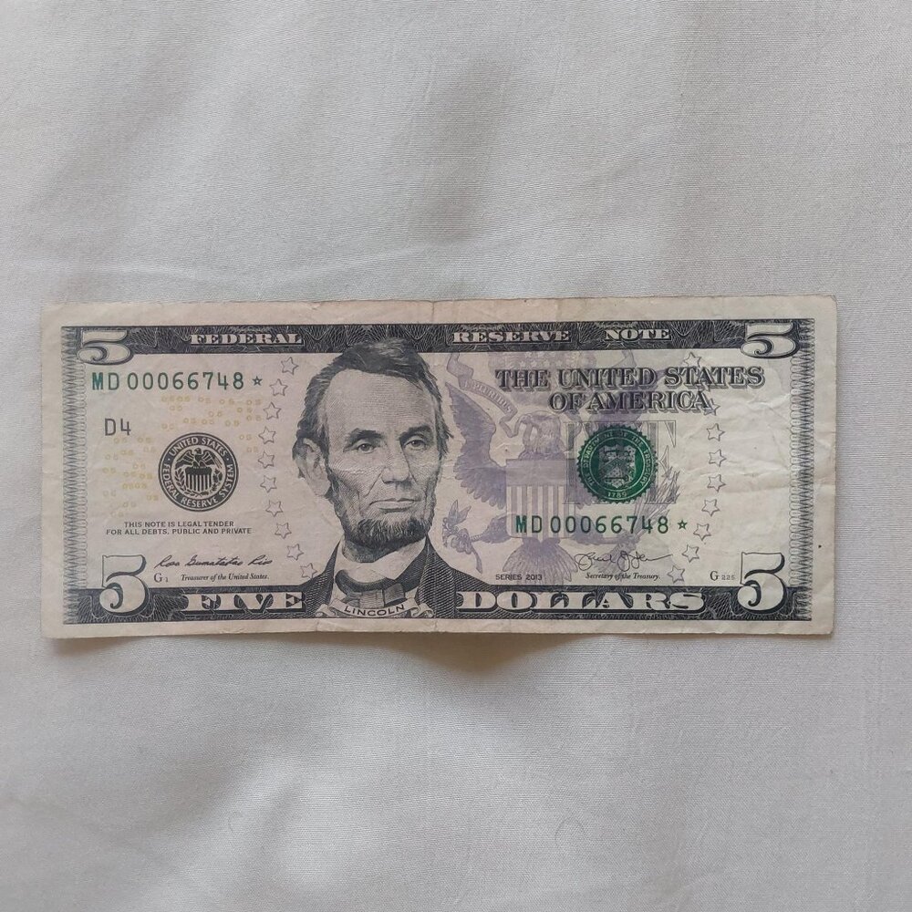 $5 dollar bill with star note and low serial number